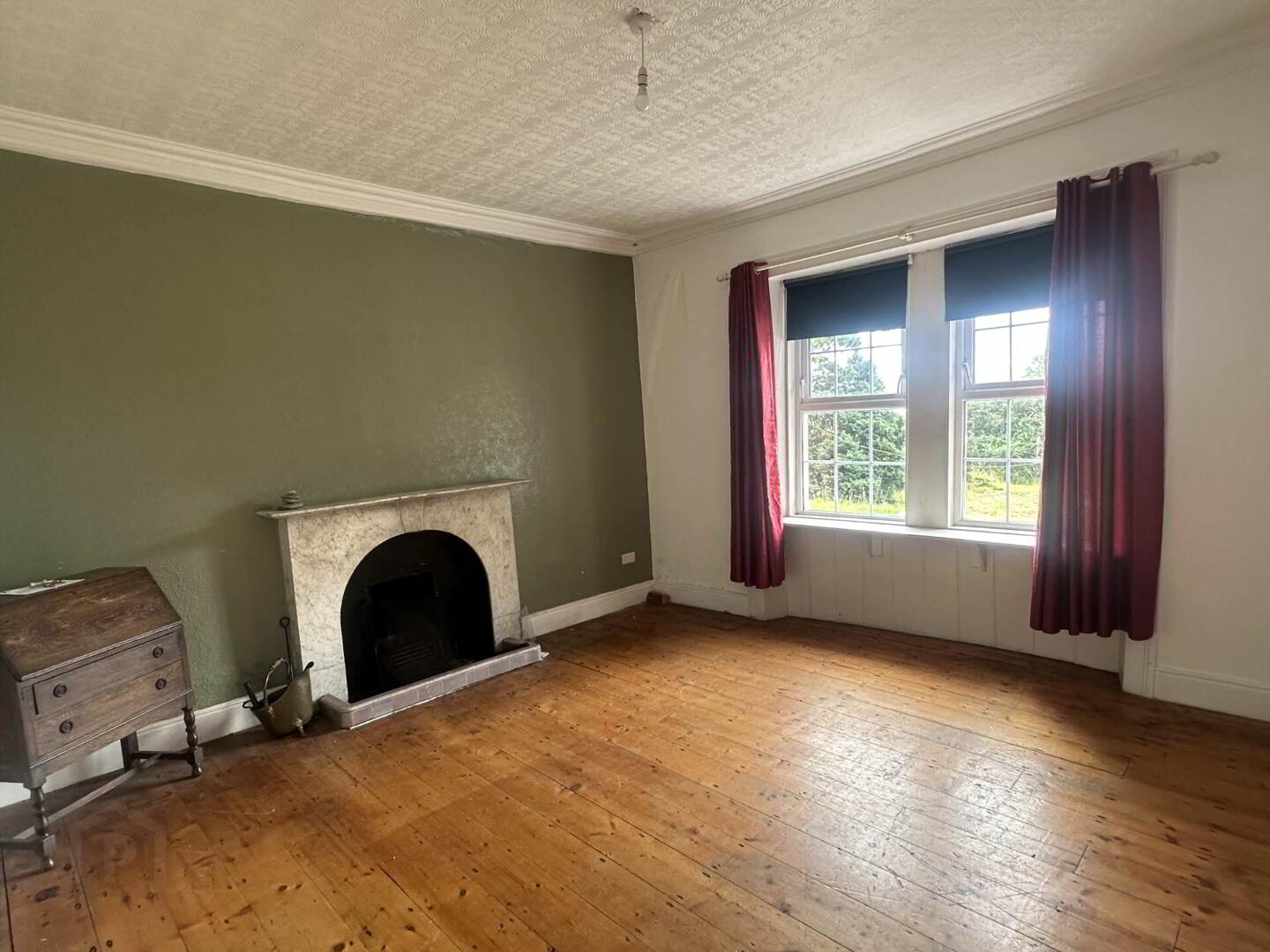 Drawing room with marble fireplace and original floors